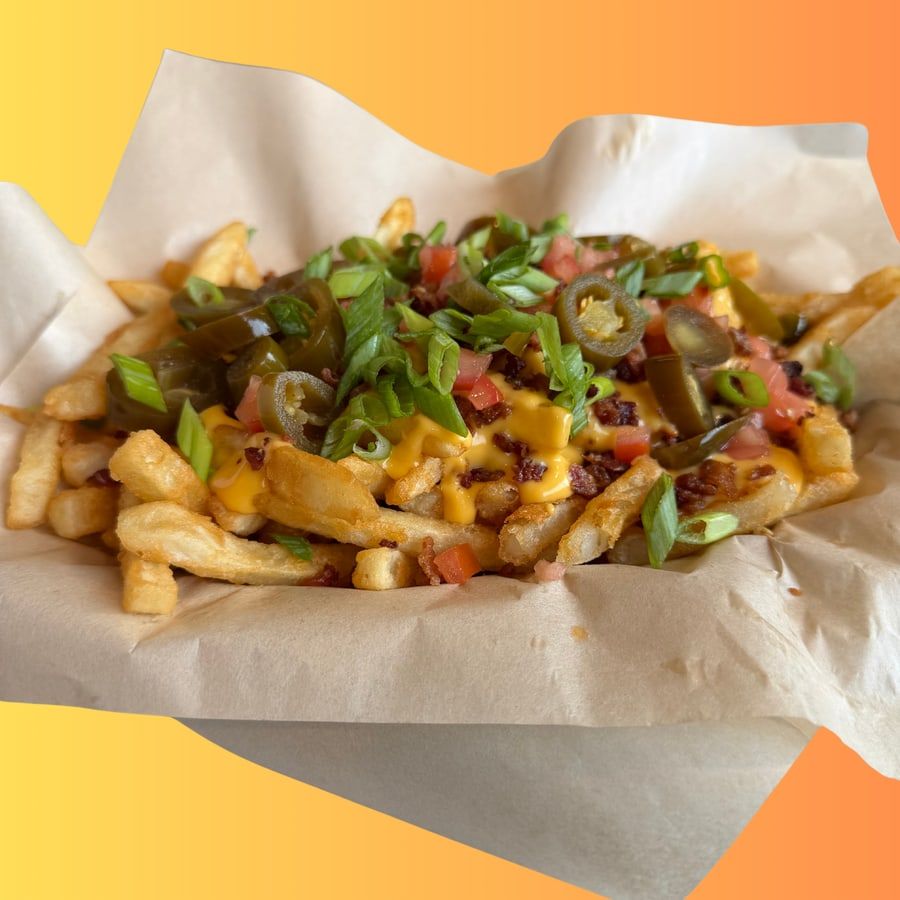Loaded French fries with cheese, bacon, jalapenos and pico